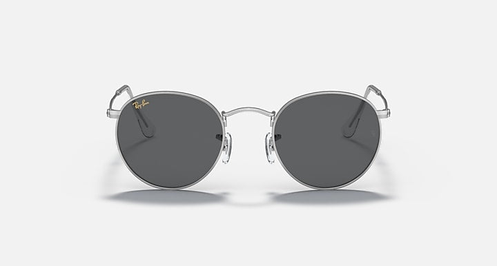 Round metal sunglasses with dark gray lenses and shiny silver frame, front view.