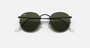 Round metal sunglasses with black lenses and black frame, front view.
