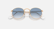 Round metal sunglasses by Ray-Ban, rose gold frames, blue mirrored lenses, angled front