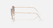 Round metal sunglasses by Ray-Ban, rose gold frames, side profile, round blue lenses