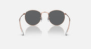 Round metal sunglasses with rose gold frames and dark lenses, full front view.