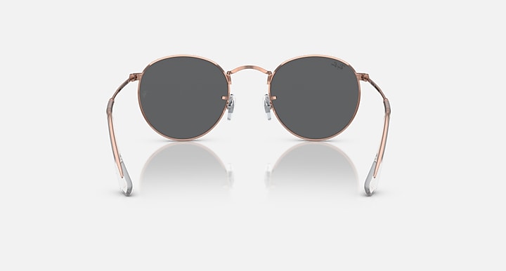 Round metal sunglasses with rose gold frames and dark lenses, full front view.