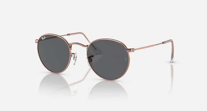Round metal sunglasses with rose gold frames and dark mirrored lenses.