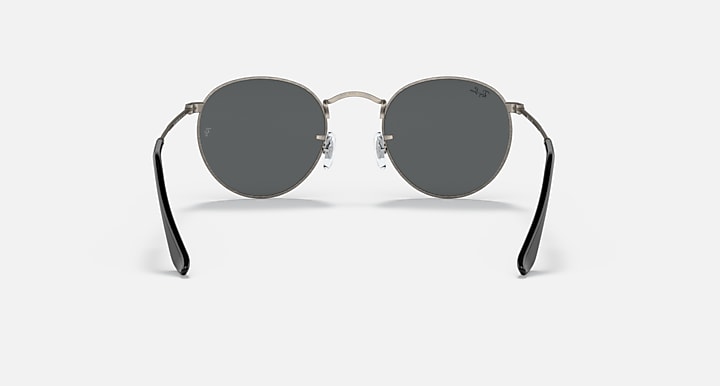 Round metal sunglasses with dark frames and smoky gray lenses