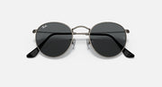 Round metal sunglasses with dark frames and black tinted lenses