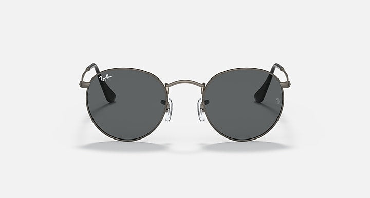 Round metal sunglasses with dark frames and deep charcoal tinted lenses