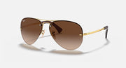Ray-Ban aviator sunglasses with gold frame and brown gradient lenses
