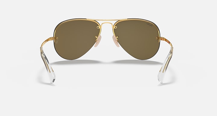 Aviator sunglasses with gold frame and dark brown lenses, front view