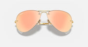 Aviator sunglasses with gold frame and peach gradient lenses, close front view