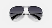 Ray-Ban aviator sunglasses with silver frame and dark lenses, top view
