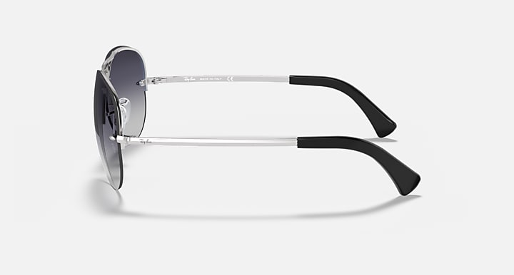 Ray-Ban aviator sunglasses with silver frame and black temple tips, side view