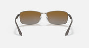 Ray-Ban RB3498 sunglasses with rectangular brown gradient lenses and silver-tone metal frame, front