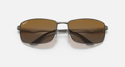 Ray-Ban RB3498 sunglasses with dark brown lenses and silver-tone metal frame, top angle