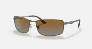 Ray-Ban RB3498 sunglasses with brown gradient lenses and silver-tone metal frame, side view