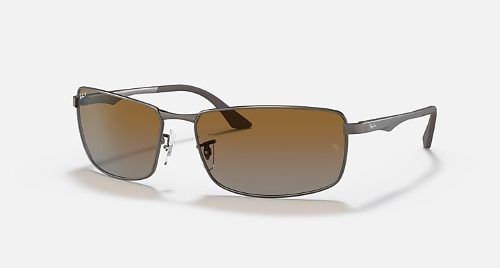 Ray-Ban RB3498 sunglasses with brown gradient lenses and silver-tone metal frame, side view