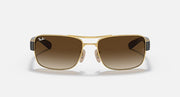 Brown gradient-lens sunglasses with gold frame and small square front, front view.