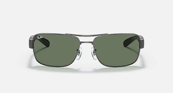 Green-lens sunglasses with dark metal frame, front view with shield-shaped lenses.