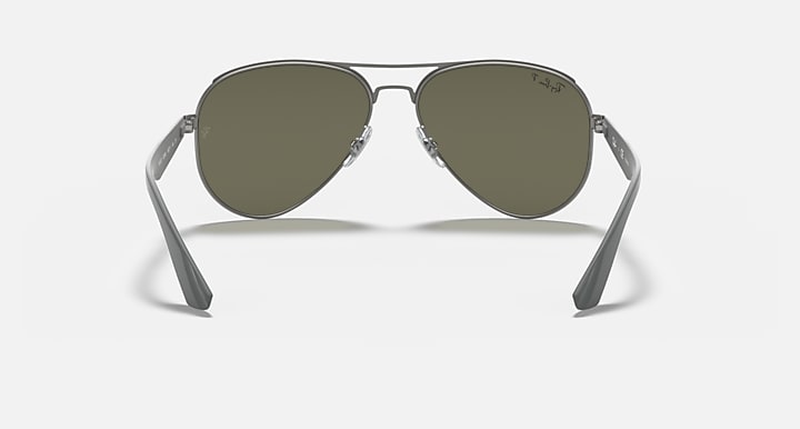 Aviator sunglasses front view with dark green lenses and slim silver temples