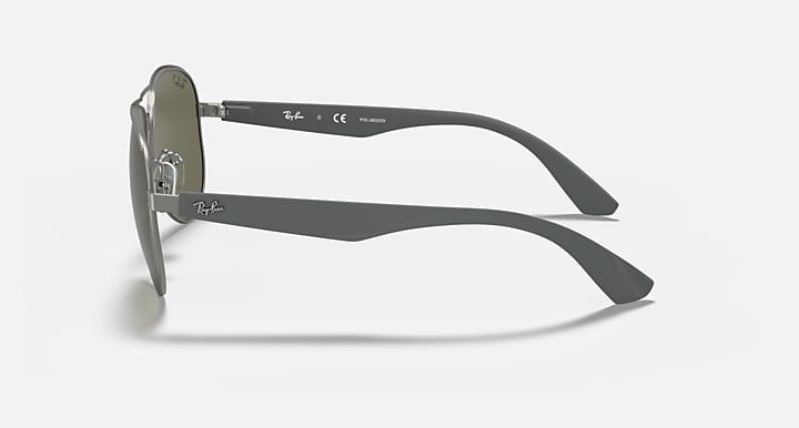 Aviator sunglasses side view with matte silver frame and dark green lens tint