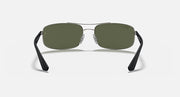 Sunglasses with dark green lenses and clear metal bridge with black end tips