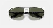 Sunglasses with dark green mirrored lenses, black frame, and metal bridge