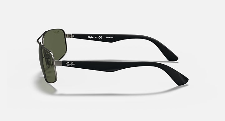 Black sunglasses with dark green lenses and side temple detail