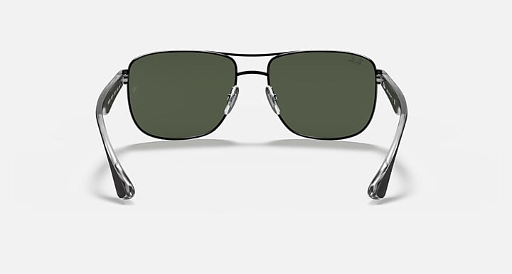Ray-Ban RB3533 sunglasses with dark green lenses and clear metal frame