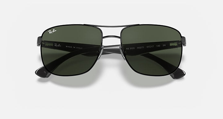 Ray-Ban RB3533 sunglasses with dark green lenses and logo text on metal arms