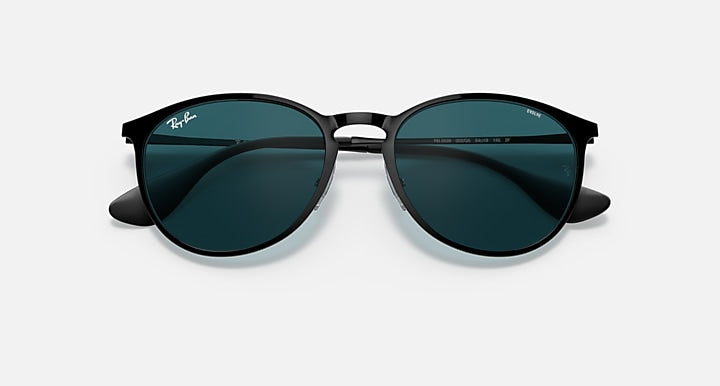 Black metal round sunglasses with dark teal lenses and Ray-Ban script on temples