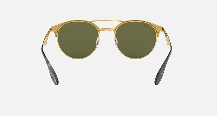 Ray-Ban RB3545 round sunglasses with gold-tone frame and dark green lenses