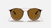 Round brown sunglasses with thin rose-gold frame and tinted amber lenses