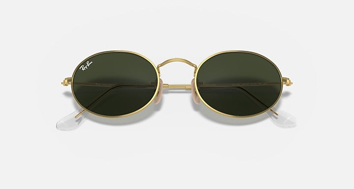 Gold round sunglasses with dark green lenses and metal bridge detail