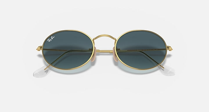 Gold round sunglasses with dark blue lenses and metal bridge, front view