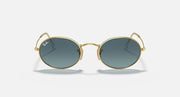 Gold round sunglasses with deep green lenses, front close-up