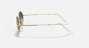 Gold thin metal sunglasses, side view, blue-tinted lenses