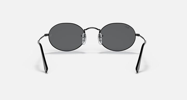 Ray-Ban round sunglasses with dark lenses and black metal frame, centered front angle