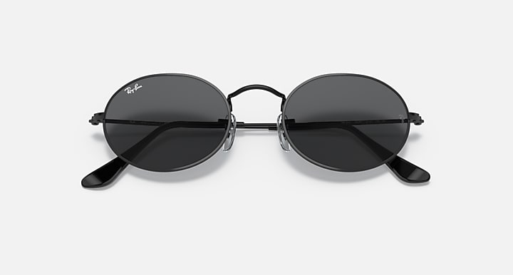 Ray-Ban round sunglasses with dark lenses and black metal frame, angled front view