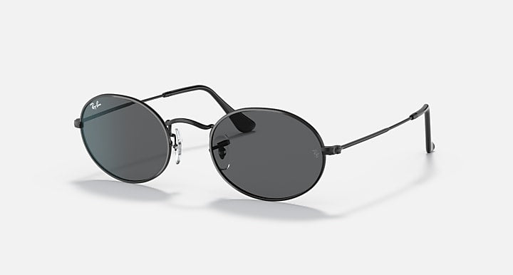 Ray-Ban round sunglasses with dark lenses and black metal frame, side profile view