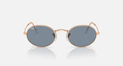 Ray-Ban round sunglasses with blue-gray lenses and rose gold metal frame, front view