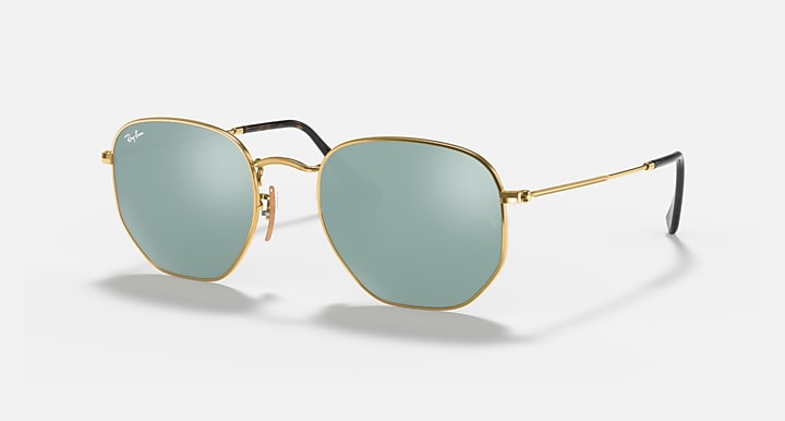 Hexagonal flat sunglasses with gold frame and light blue tinted lenses, front view