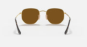 Ray-Ban hexagonal flat sunglasses with dark brown lenses and gold frame, front view