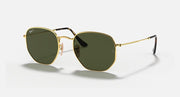 Hexagonal flat sunglasses with gold frame and dark green lenses, black temple tips