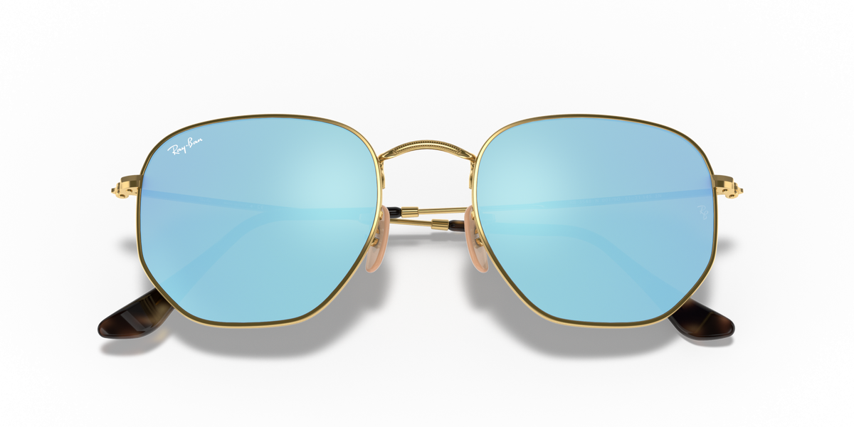 Ray-Ban hexagonal flat sunglasses with gold frame and pale blue gradient lenses