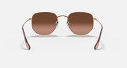 Ray-Ban hexagonal flat-lens sunglasses with brown lenses and slim rose-gold frame