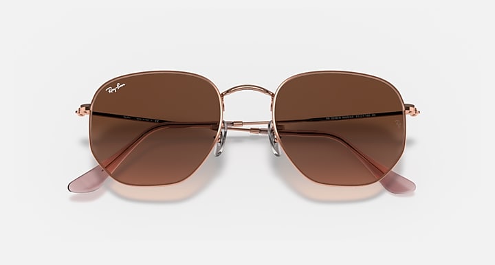 Ray-Ban hexagonal sunglasses, brown lenses, rose-gold bridge detail and temple tips