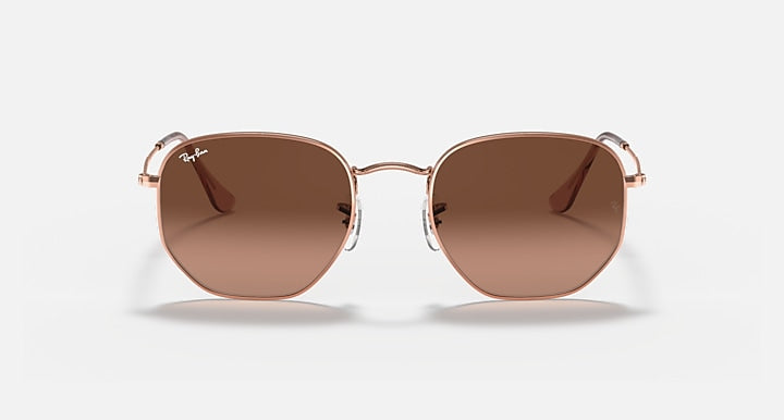 Ray-Ban hexagonal sunglasses with tinted brown lenses and rose-gold double-bridge
