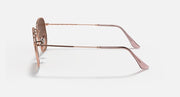Ray-Ban hexagonal sunglasses frame with brown lenses, rose-gold temples and hinges