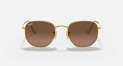 Hexagonal flat sunglasses with gold frame and brown lenses, front view