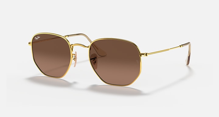 Hexagonal flat sunglasses with gold frame and brown gradient lenses