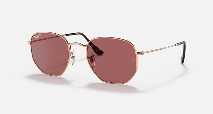 Rose gold hexagonal flat sunglasses with rose-tinted lenses and slim metal temples